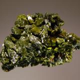 Pyromorphite
Wheatley Mine, Phoenixville, Chester County, Pennsylvania, USA
3.0 x 4.5 cm
Olive-green, pyromorphite crystals to 0.7 cm forming a solid crystallized mass.  A few crystals are hoppered, but most are terminated with a simple pinacoid. (Author: crosstimber)