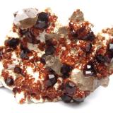 Spessartine and smoky quartz on feldspar<br />Wushan Spessartine prospects, Tongbei, Yunxiao, Zhangzhou Prefecture, Fujian Province, China<br />Specimen size 8 cm<br /> (Author: Tobi)