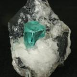 Beryl (variety emerald), Calcite<br />Muzo mining district, La Pava Mine, Quípama, Municipio Muzo, Western Emerald Belt, Boyacá Department, Colombia<br />38x24x33mm<br /> (Author: Fiebre Verde)