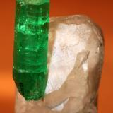 Beryl (variety emerald), Calcite<br />Muzo mining district, Western Emerald Belt, Boyacá Department, Colombia<br />Emerald 18mm / Calcite 24mm<br /> (Author: Fiebre Verde)