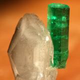 Beryl (variety emerald), Calcite<br />Muzo mining district, Western Emerald Belt, Boyacá Department, Colombia<br />Emerald 18mm / Calcite 24mm<br /> (Author: Fiebre Verde)