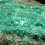 Beryl (variety emerald), Calcite<br />La Pita mining district, Cunas Mine, Municipio Maripí, Western Emerald Belt, Boyacá Department, Colombia<br />Detail - FOV=3cm<br /> (Author: Fiebre Verde)