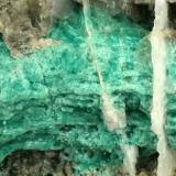Beryl (variety emerald), Calcite<br />La Pita mining district, Cunas Mine, Municipio Maripí, Western Emerald Belt, Boyacá Department, Colombia<br />Detail - FOV=7cm<br /> (Author: Fiebre Verde)