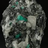 Beryl (variety emerald), Calcite<br />Coscuez mining district, Municipio San Pablo de Borbur, Western Emerald Belt, Boyacá Department, Colombia<br />95x75x75mm - main emerald xl=15mm<br /> (Author: Fiebre Verde)