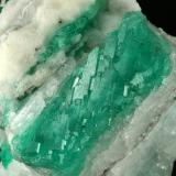 Beryl (variety emerald), Calcite<br />Coscuez mining district, Municipio San Pablo de Borbur, Western Emerald Belt, Boyacá Department, Colombia<br />Detail - FOV=6cm<br /> (Author: Fiebre Verde)