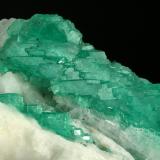 Beryl (variety emerald), Calcite<br />Coscuez mining district, Municipio San Pablo de Borbur, Western Emerald Belt, Boyacá Department, Colombia<br />Detail - FOV=6cm<br /> (Author: Fiebre Verde)