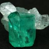 Beryl (variety emerald), Calcite<br />Muzo mining district, Western Emerald Belt, Boyacá Department, Colombia<br />Main crystal = 13mm<br /> (Author: Fiebre Verde)