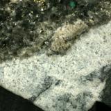 Beryl (variety emerald), Calcite, Pyrite, Albite<br />Muzo mining district, Western Emerald Belt, Boyacá Department, Colombia<br />Detail - FOV=5cm<br /> (Author: Fiebre Verde)