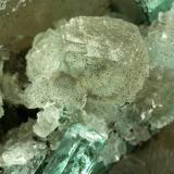 Beryl (variety emerald), Calcite<br />Coscuez mining district, Municipio San Pablo de Borbur, Western Emerald Belt, Boyacá Department, Colombia<br />85x80x60mm - FOV=4mm<br /> (Author: Fiebre Verde)