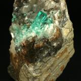 Beryl (variety emerald), Calcite<br />Coscuez mining district, Municipio San Pablo de Borbur, Western Emerald Belt, Boyacá Department, Colombia<br />85x80x60mm<br /> (Author: Fiebre Verde)