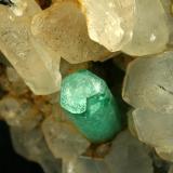 Beryl (variety emerald), Calcite<br />La Pita mining district, Polveros Mine, Municipio Maripí, Western Emerald Belt, Boyacá Department, Colombia<br />Detail - FOV=4cm<br /> (Author: Fiebre Verde)