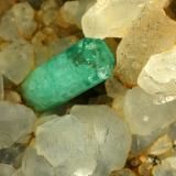 Beryl (variety emerald), Calcite<br />La Pita mining district, Polveros Mine, Municipio Maripí, Western Emerald Belt, Boyacá Department, Colombia<br />Detail - FOV=4cm<br /> (Author: Fiebre Verde)