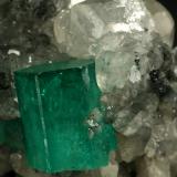 Beryl (variety emerald), Calcite<br />La Pita mining district, Cunas Mine, Municipio Maripí, Western Emerald Belt, Boyacá Department, Colombia<br />60x50x35mm<br /> (Author: Fiebre Verde)