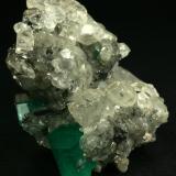 Beryl (variety emerald), Calcite<br />La Pita mining district, Cunas Mine, Municipio Maripí, Western Emerald Belt, Boyacá Department, Colombia<br />60x50x35mm<br /> (Author: Fiebre Verde)