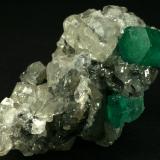 Beryl (variety emerald), Calcite<br />La Pita mining district, Cunas Mine, Municipio Maripí, Western Emerald Belt, Boyacá Department, Colombia<br />60x50x35mm<br /> (Author: Fiebre Verde)