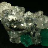 Beryl (variety emerald), Calcite<br />La Pita mining district, Cunas Mine, Municipio Maripí, Western Emerald Belt, Boyacá Department, Colombia<br />60x50x35mm<br /> (Author: Fiebre Verde)