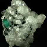 Beryl (variety emerald), Calcite<br />La Pita mining district, Polveros Mine, Municipio Maripí, Western Emerald Belt, Boyacá Department, Colombia<br />80x55x80mm<br /> (Author: Fiebre Verde)