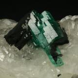 Beryl (variety emerald), Calcite<br />Muzo mining district, Western Emerald Belt, Boyacá Department, Colombia<br />60x45x28mm<br /> (Author: Fiebre Verde)