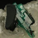 Beryl (variety emerald), Calcite<br />Muzo mining district, Western Emerald Belt, Boyacá Department, Colombia<br />60x45x28mm<br /> (Author: Fiebre Verde)