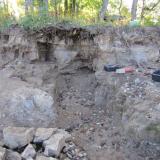 Work on the upper bench revealed a fractured zone that allowed progress into ledge. After a point we were able to put the 100 ton ram in the slot and break rock on both sides of the slot. (Author: vic rzonca)