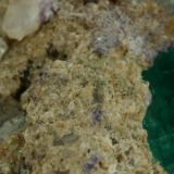 Beryl (variety emerald), Calcite<br />La Pita mining district, Cunas Mine, Municipio Maripí, Western Emerald Belt, Boyacá Department, Colombia<br />Detail - FOV=2cm<br /> (Author: Fiebre Verde)