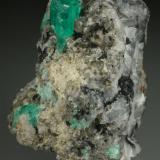 Beryl (variety emerald), Calcite<br />Coscuez mining district, Municipio San Pablo de Borbur, Western Emerald Belt, Boyacá Department, Colombia<br />35x40x55mm<br /> (Author: Fiebre Verde)