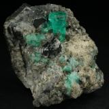 Beryl (variety emerald), Calcite<br />Coscuez mining district, Municipio San Pablo de Borbur, Western Emerald Belt, Boyacá Department, Colombia<br />35x40x55mm<br /> (Author: Fiebre Verde)