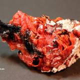 Vanadinite, Calcite, Manganese OxidesTaouz, Er Rachidia Province, Drâa-Tafilalet Region, Morocco8.2 x 4.4 x 3.3 cm (Author: Don Lum)