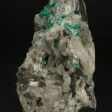 Beryl (variety emerald), Calcite<br />La Pita mining district, Municipio Maripí, Western Emerald Belt, Boyacá Department, Colombia<br />75x55x90mm<br /> (Author: Fiebre Verde)