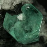 Beryl (variety emerald), Calcite<br />Muzo mining district, La Pava Mine, Quípama, Municipio Muzo, Western Emerald Belt, Boyacá Department, Colombia<br />Emerald crystal = 10mm<br /> (Author: Fiebre Verde)