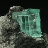 Beryl (variety emerald), Calcite<br />Muzo mining district, La Pava Mine, Quípama, Municipio Muzo, Western Emerald Belt, Boyacá Department, Colombia<br />Emerald crystal = 10mm<br /> (Author: Fiebre Verde)