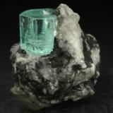 Beryl (variety emerald), Calcite<br />Muzo mining district, La Pava Mine, Quípama, Municipio Muzo, Western Emerald Belt, Boyacá Department, Colombia<br />Emerald crystal = 10mm<br /> (Author: Fiebre Verde)