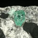 Beryl (variety emerald), Calcite, Pyrite<br />Muzo mining district, La Pava Mine, Quípama, Municipio Muzo, Western Emerald Belt, Boyacá Department, Colombia<br />xl=7mm<br /> (Author: Fiebre Verde)