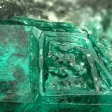 Beryl (variety emerald), Calcite<br />La Pita mining district, Municipio Maripí, Western Emerald Belt, Boyacá Department, Colombia<br />40mm across, xl=15mm<br /> (Author: Fiebre Verde)