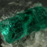 Beryl (variety emerald), Calcite<br />La Pita mining district, Municipio Maripí, Western Emerald Belt, Boyacá Department, Colombia<br />40mm across, xl=15mm<br /> (Author: Fiebre Verde)