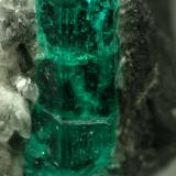 Beryl (variety emerald), Calcite<br />La Pita mining district, Municipio Maripí, Western Emerald Belt, Boyacá Department, Colombia<br />40mm across, xl=15mm<br /> (Author: Fiebre Verde)