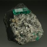 Beryl (variety emerald), Calcite<br />La Pita mining district, Municipio Maripí, Western Emerald Belt, Boyacá Department, Colombia<br />40mm across, xl=15mm<br /> (Author: Fiebre Verde)