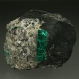 Beryl (variety emerald), Calcite<br />La Pita mining district, Municipio Maripí, Western Emerald Belt, Boyacá Department, Colombia<br />40mm across, xl=15mm<br /> (Author: Fiebre Verde)