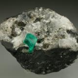 Beryl (variety emerald), Calcite, Pyrite<br />Chivor mining district, Municipio Chivor, Eastern Emerald Belt, Boyacá Department, Colombia<br />35x45mm, xl=6mm<br /> (Author: Fiebre Verde)