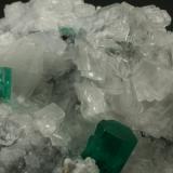 Beryl (variety emerald), Calcite, Parisite<br />Muzo mining district, Western Emerald Belt, Boyacá Department, Colombia<br />70x45x50mm - Detail<br /> (Author: Fiebre Verde)