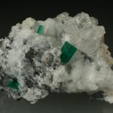 Beryl (variety emerald), Calcite, Parisite<br />Muzo mining district, Western Emerald Belt, Boyacá Department, Colombia<br />70x45x50mm<br /> (Author: Fiebre Verde)