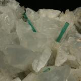 Beryl (variety emerald), Calcite, Pyrite<br />Chivor mining district, Municipio Chivor, Eastern Emerald Belt, Boyacá Department, Colombia<br />Detail - Rightmost emerald is 10mm long<br /> (Author: Fiebre Verde)