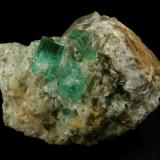 Beryl (variety emerald), Calcite<br />Chivor mining district, Municipio Chivor, Eastern Emerald Belt, Boyacá Department, Colombia<br />52mm across<br /> (Author: Fiebre Verde)