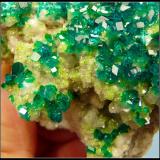 Dioptase on calcite.<br />Tsumeb Mine, Tsumeb, Otjikoto Region, Namibia<br />52 x 47 x 30 mm<br /> (Author: Pierre Joubert)