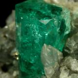 Beryl (variety emerald), Calcite, Pyrite<br />Muzo mining district, Western Emerald Belt, Boyacá Department, Colombia<br />xl=14mm<br /> (Author: Fiebre Verde)