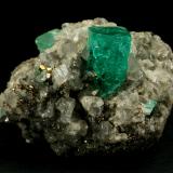 Beryl (variety emerald), Calcite, Pyrite<br />Muzo mining district, Western Emerald Belt, Boyacá Department, Colombia<br />42x29x30mm<br /> (Author: Fiebre Verde)