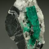 Beryl (variety emerald), Calcite<br />Muzo mining district, Western Emerald Belt, Boyacá Department, Colombia<br />28x51x49mm, xl=30mm<br /> (Author: Fiebre Verde)