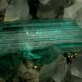 Beryl (variety emerald), Calcite, Pyrite<br />Chivor mining district, Municipio Chivor, Eastern Emerald Belt, Boyacá Department, Colombia<br />40x42x42mm, xl=18mm<br /> (Author: Fiebre Verde)