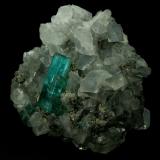 Beryl (variety emerald), Calcite, Pyrite<br />Chivor mining district, Municipio Chivor, Eastern Emerald Belt, Boyacá Department, Colombia<br />40x42x42mm, xl=18mm<br /> (Author: Fiebre Verde)