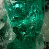 Beryl (variety emerald), Calcite, Quartz<br />Muzo mining district, Western Emerald Belt, Boyacá Department, Colombia<br />60x46x42mm, xl=13mm<br /> (Author: Fiebre Verde)